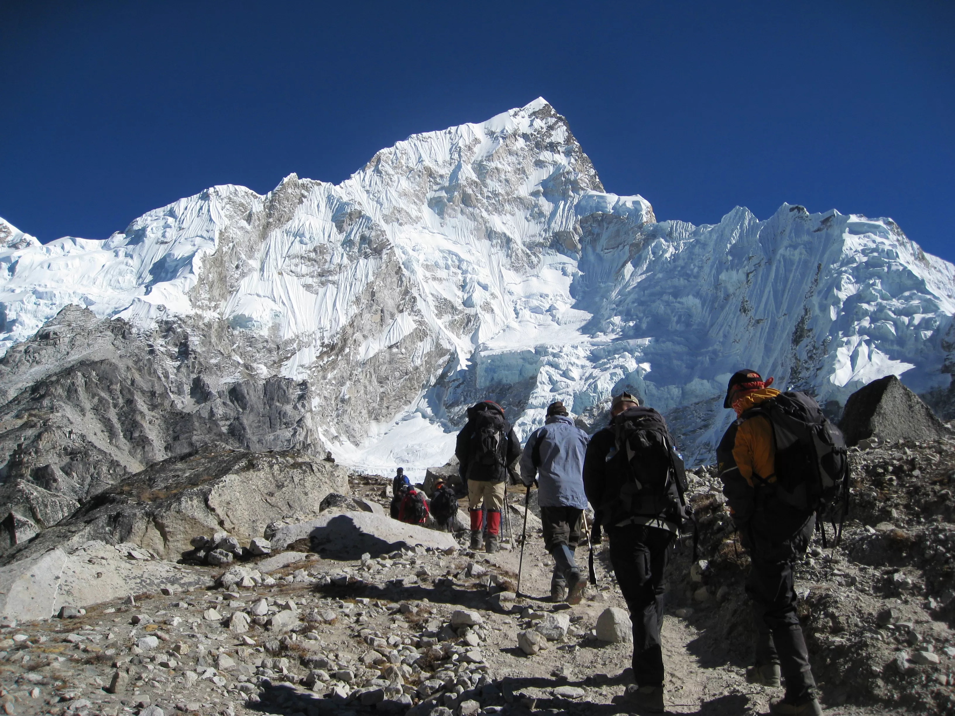 Mount Everest Marathon runners at high altitude with Himalayan peaks background in Nepal
