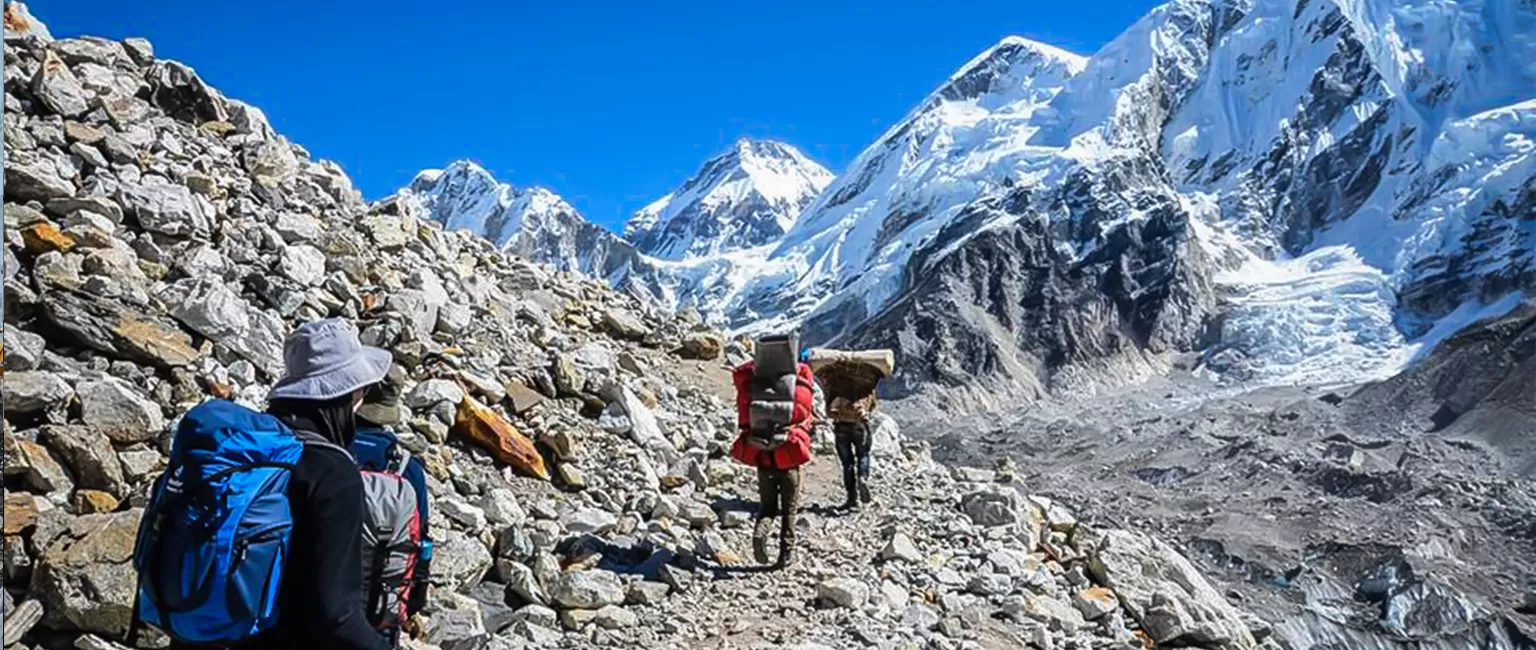 Top 16 things you need to know before your trek start to Everest Base Camp – trekkers walking with snow-covered Himalayan peaks