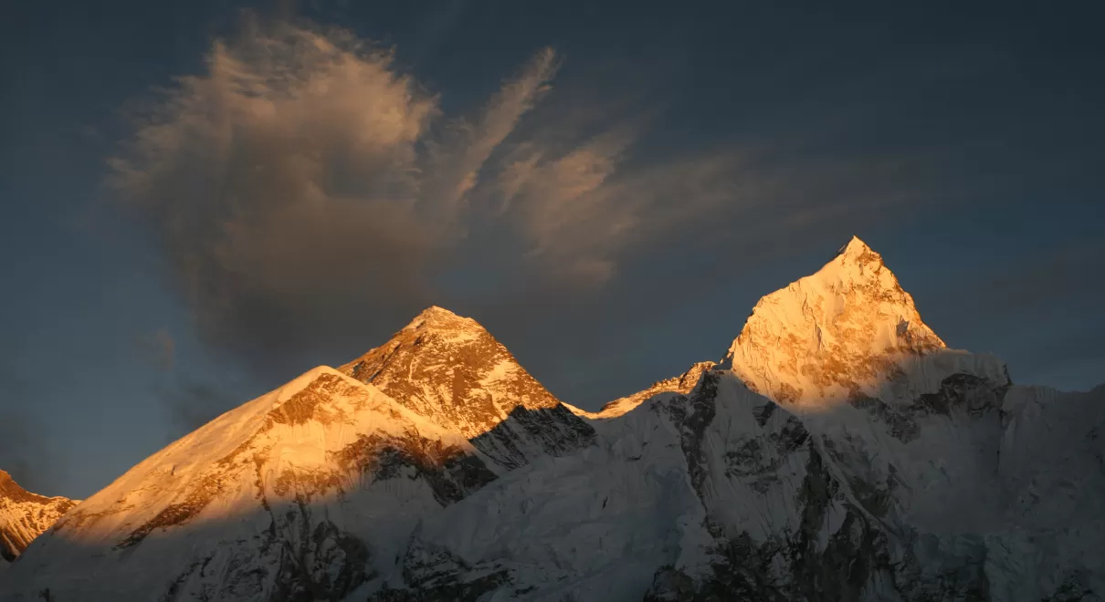 Sunrise view from Himalayas trek showing golden mountain peaks
