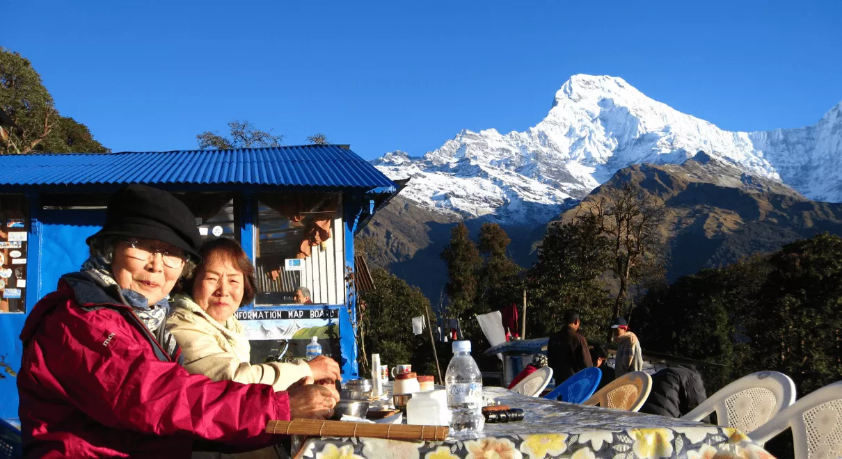 Trekking group enjoying sunrise view during 4 day trek in Nepal at Poon Hill  Let me know if you'd like more variations for other images like villages, trails, or tea houses.
