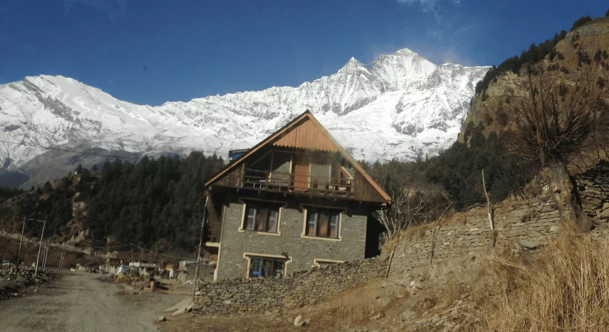 Happy family with backpacks hiking on mountain trail during summer vacation with children enjoying nature