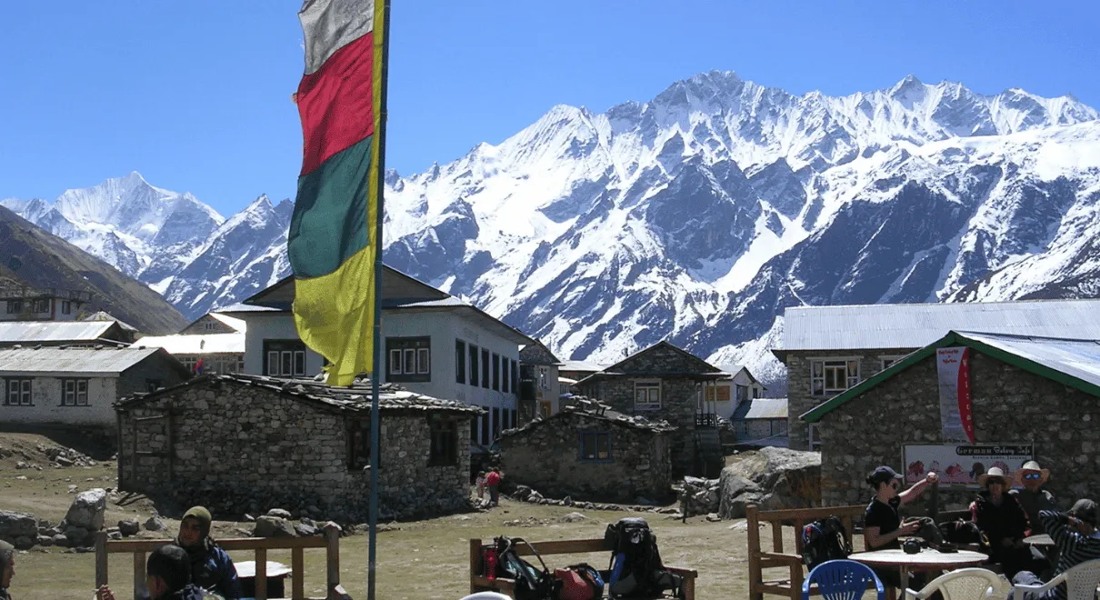 Trekkers walking through snowy path in Langtang National Park during January